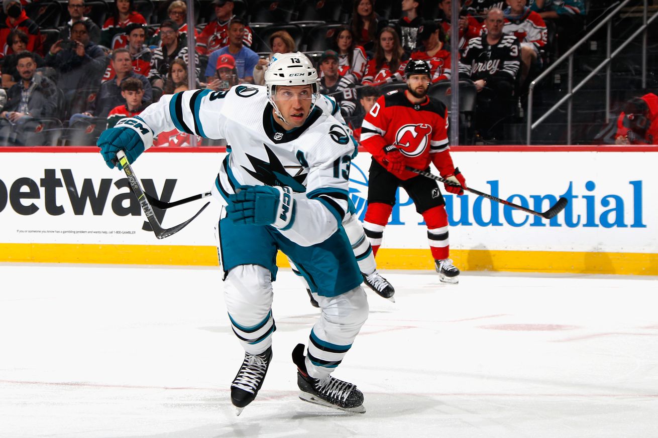 Nick Bonino #13 of the San Jose Sharks skates against the New Jersey Devils at the Prudential Center on October 22, 2022 in Newark, New Jersey.