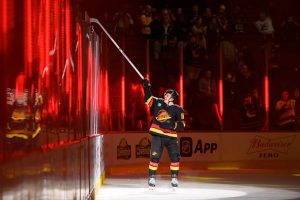 VANCOUVER, CANADA - JANUARY 24: Andrei Kuzmenko #96 of the Vancouver Canucks throws a stick to a fan after the NHL game against the Chicago Blackhawks at Rogers Arena on January 24, 2023 in Vancouver, British Columbia, Canada. Vancouver won 5-2. (Photo by Derek Cain/Getty Images)