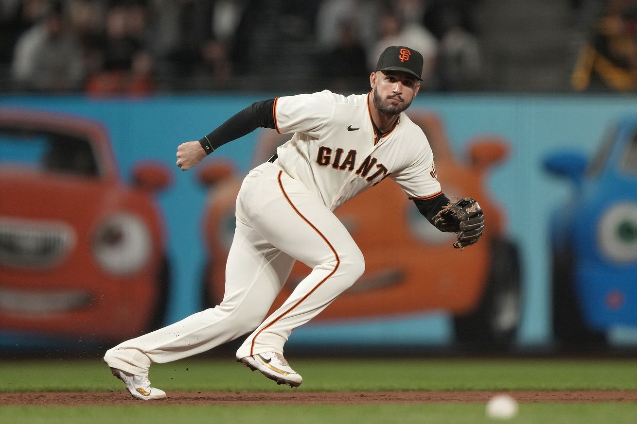 David Villar moving to his left to field a grounder