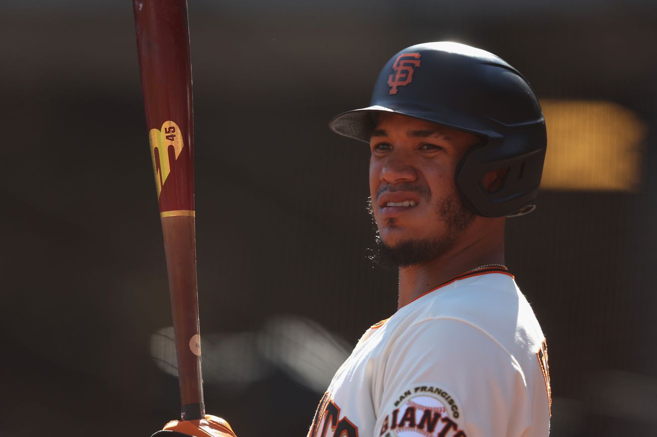 Thairo Estrada holding a bat