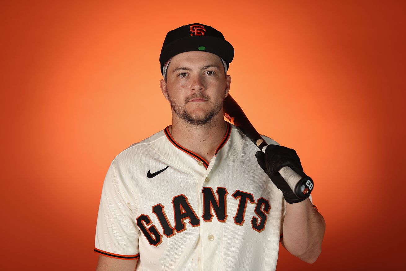 Patrick Bailey posing at media day with his bat on his shoulder