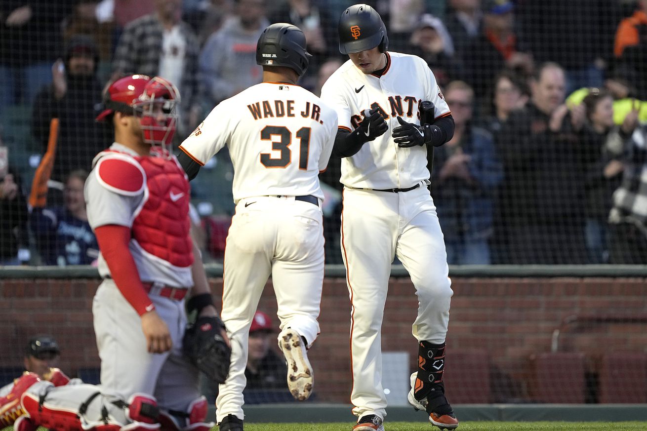 LaMonte Wade Jr. and Wilmer Flores celebrating