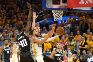 Apr 23, 2023; San Francisco, California, USA; Golden State Warriors guard Stephen Curry (center front) shoots against Sacramento Kings forward Harrison Barnes (40) and forward Domantas Sabonis (center back) during the fourth quarter of game four of the 2023 NBA playoffs at Chase Center. Mandatory Credit: Darren Yamashita-USA TODAY Sports