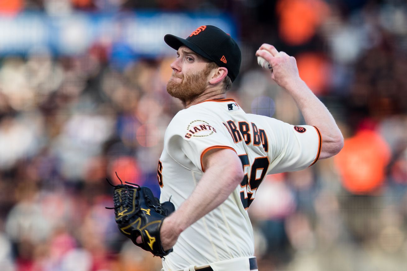 John Brebbia reaching back to throw a pitch