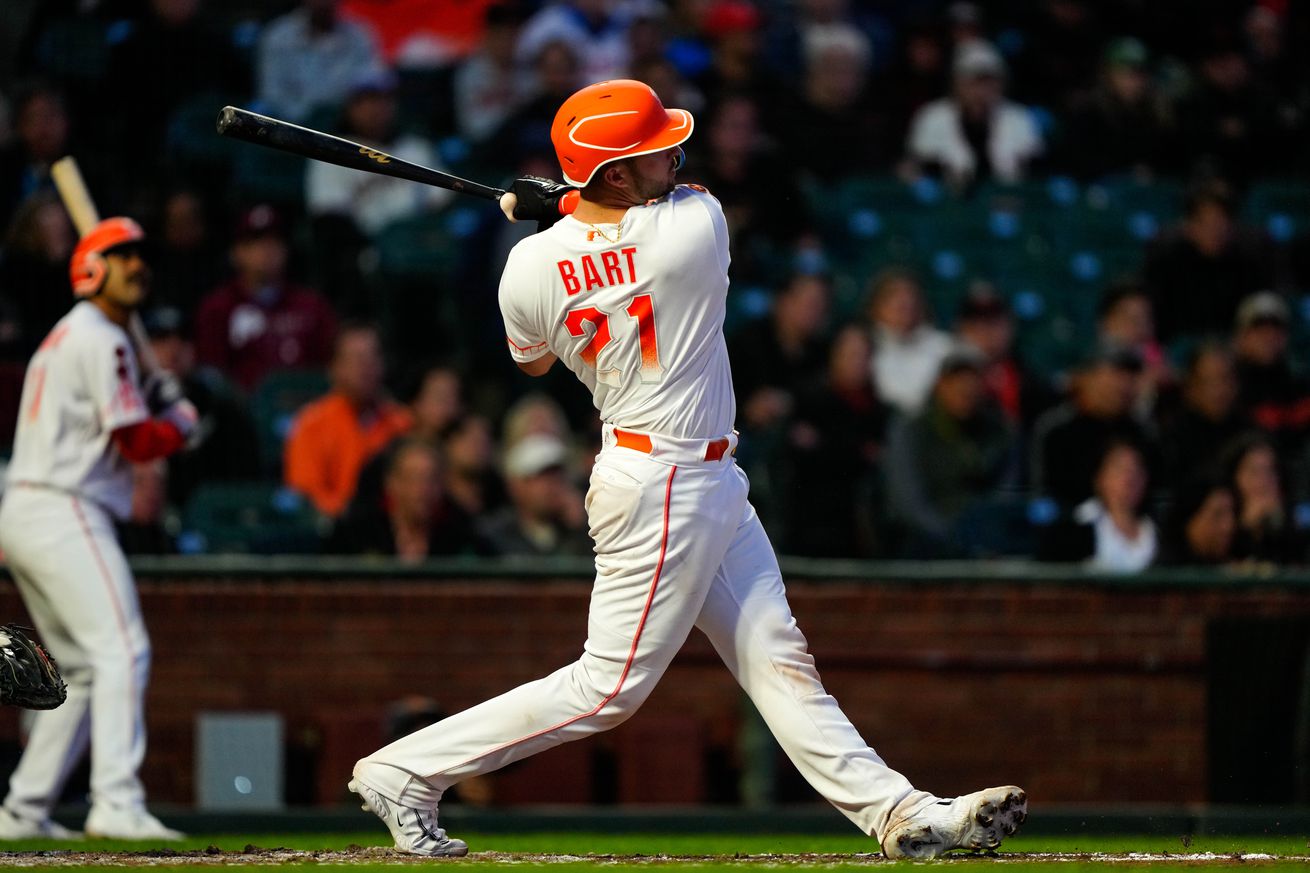 View from behind Joey Bart as he swings