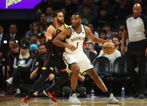 Jan 19, 2023; Phoenix, Arizona, USA; Phoenix Suns guard Duane Washington Jr. (left) defends against Brooklyn Nets forward T.J. Warren (1) at Footprint Center. Mandatory Credit: Mark J. Rebilas-USA TODAY Sports