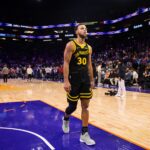 Golden State Warriors guard Stephen Curry (30) reacts as he walks off the court against the Phoenix Suns at Footprint Center.