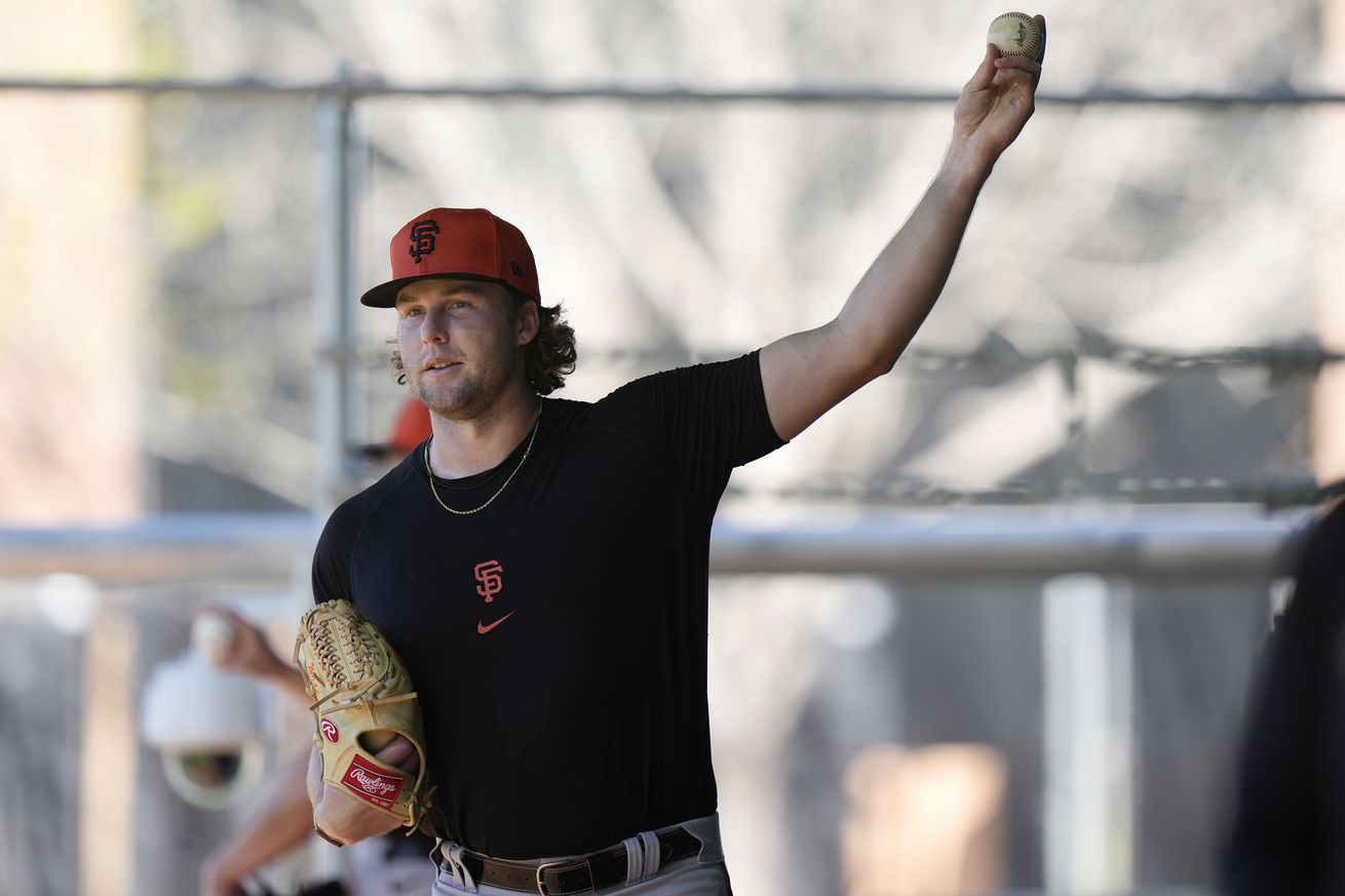 Erik Miller throwing a pitch in workout gear at Spring Training.