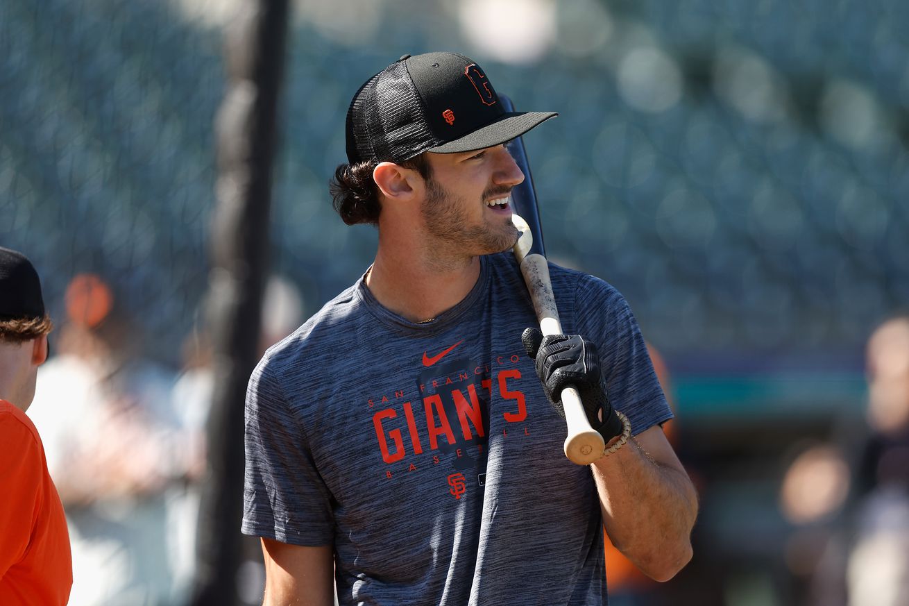 Bryce Eldridge smiling in BP with a bat on his shoulder. 