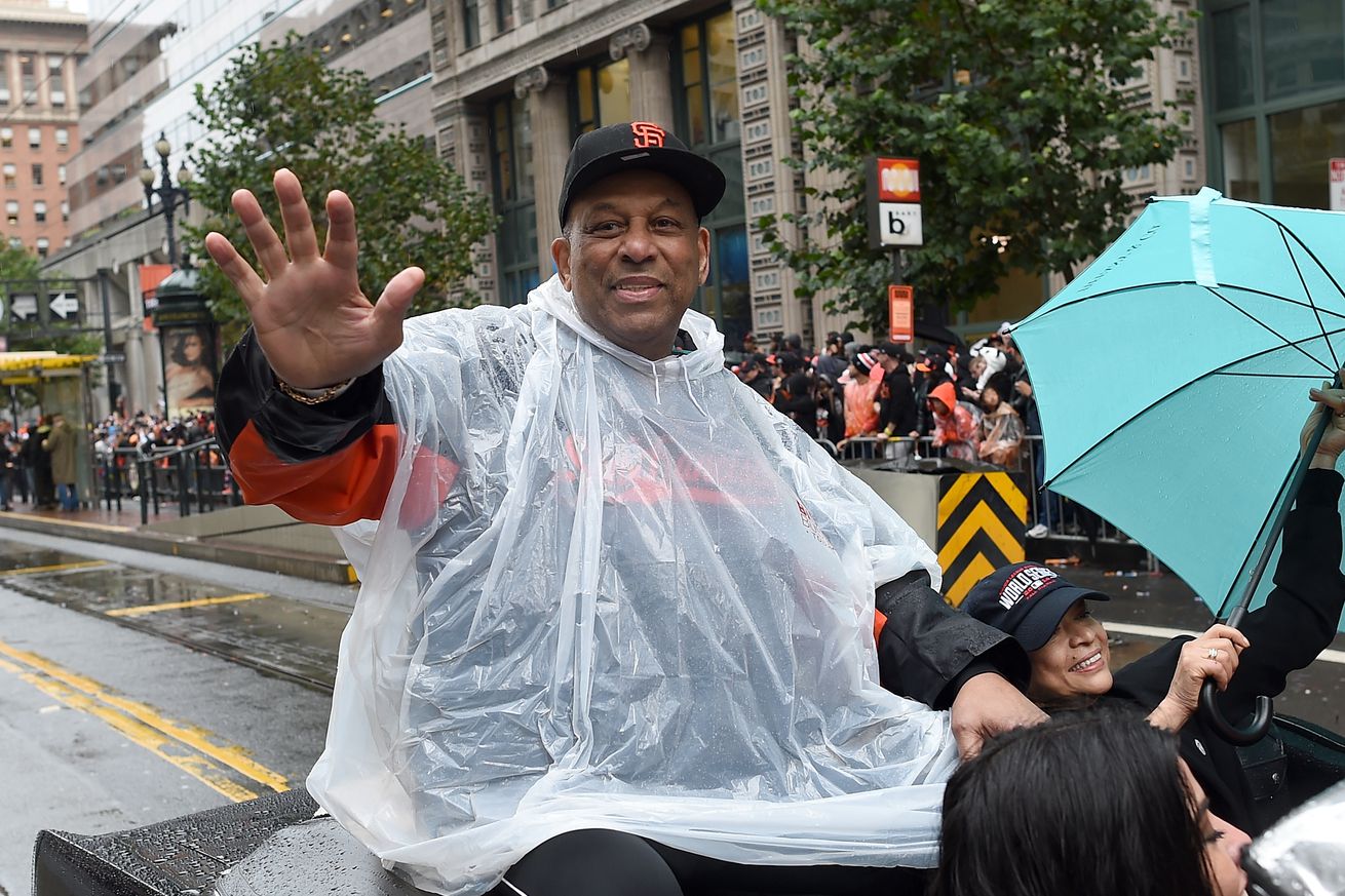 Orlando Cepeda smiling and waving at the Giants World Series parade.