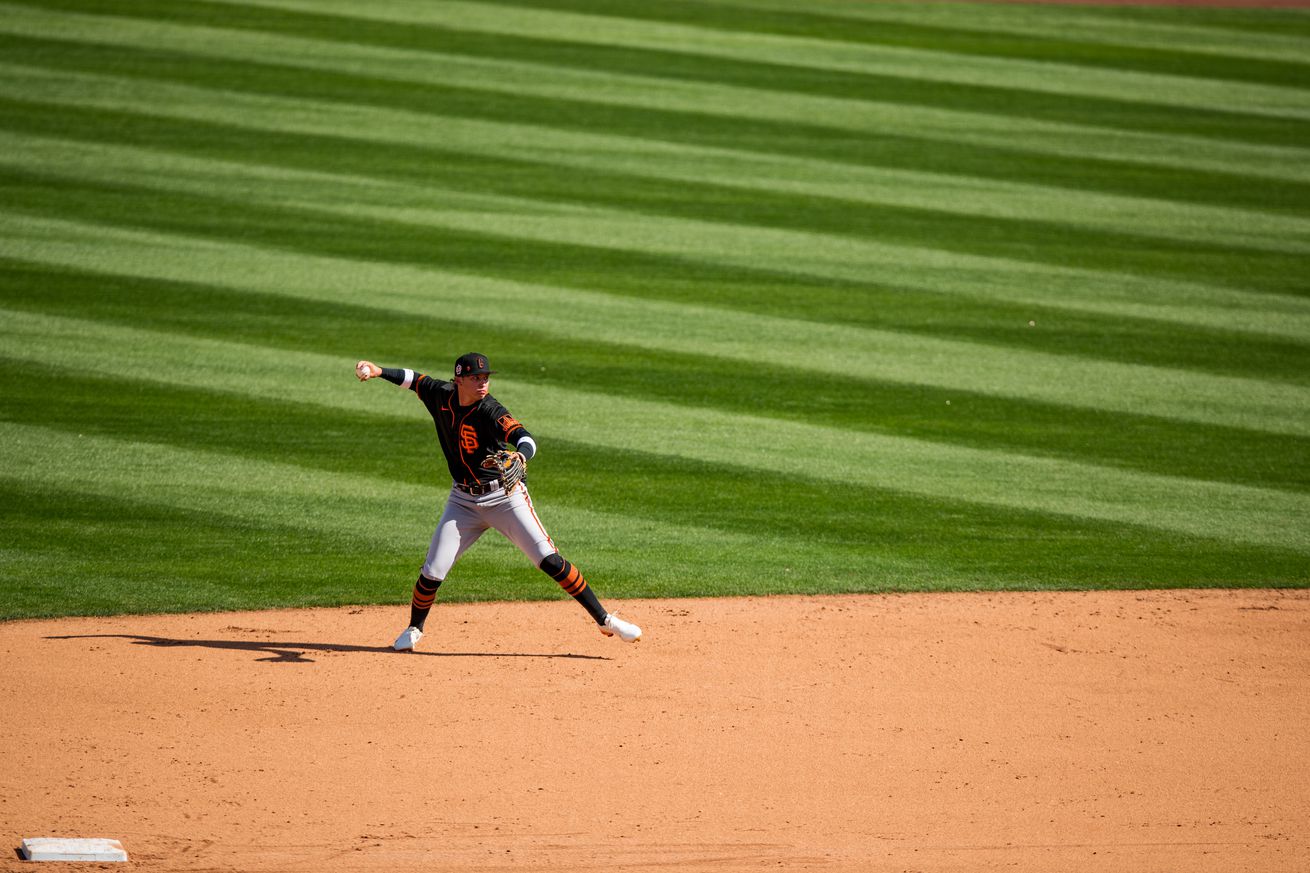 Diego Velasquez throwing a ball from shortstop at Spring Training.