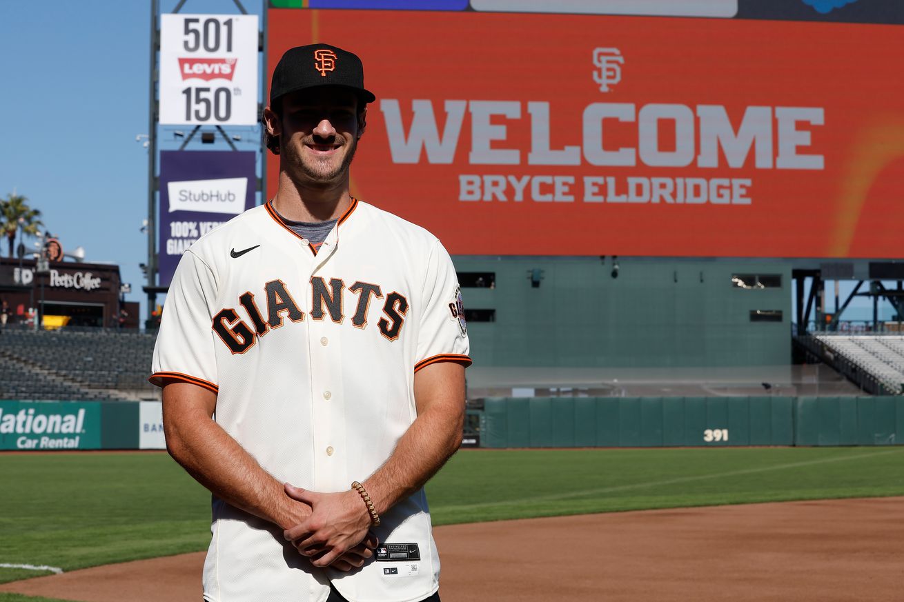 Bryce Eldridge at Oracle Park, smiling in front of the scoreboard that reads “Welcome Bryce Eldridge.” 