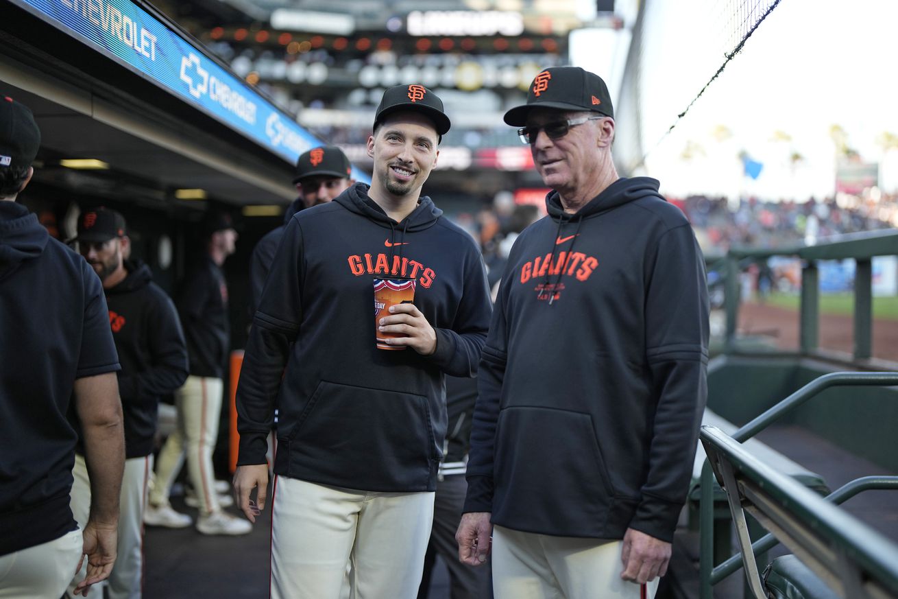 Blake Snell talking with Bob Melvin in the dugout. 