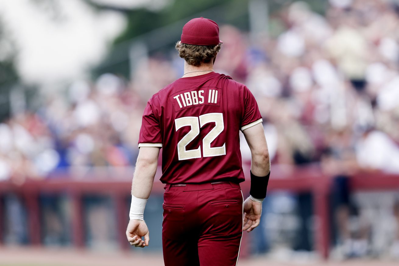 View from behind of James Tibbs III in his college jersey. 