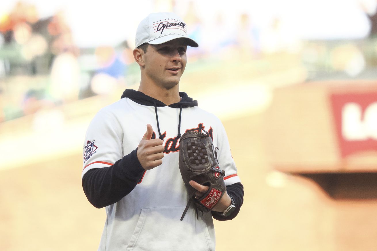 Brock Purdy getting ready to throw a first pitch at a Giants game. 