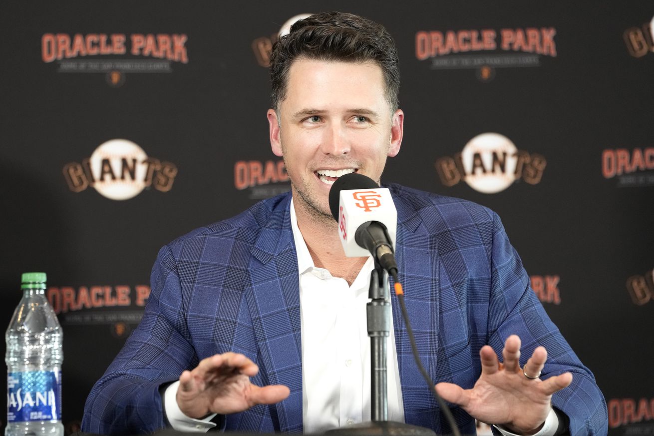 Buster Posey speaking at a press conference. 