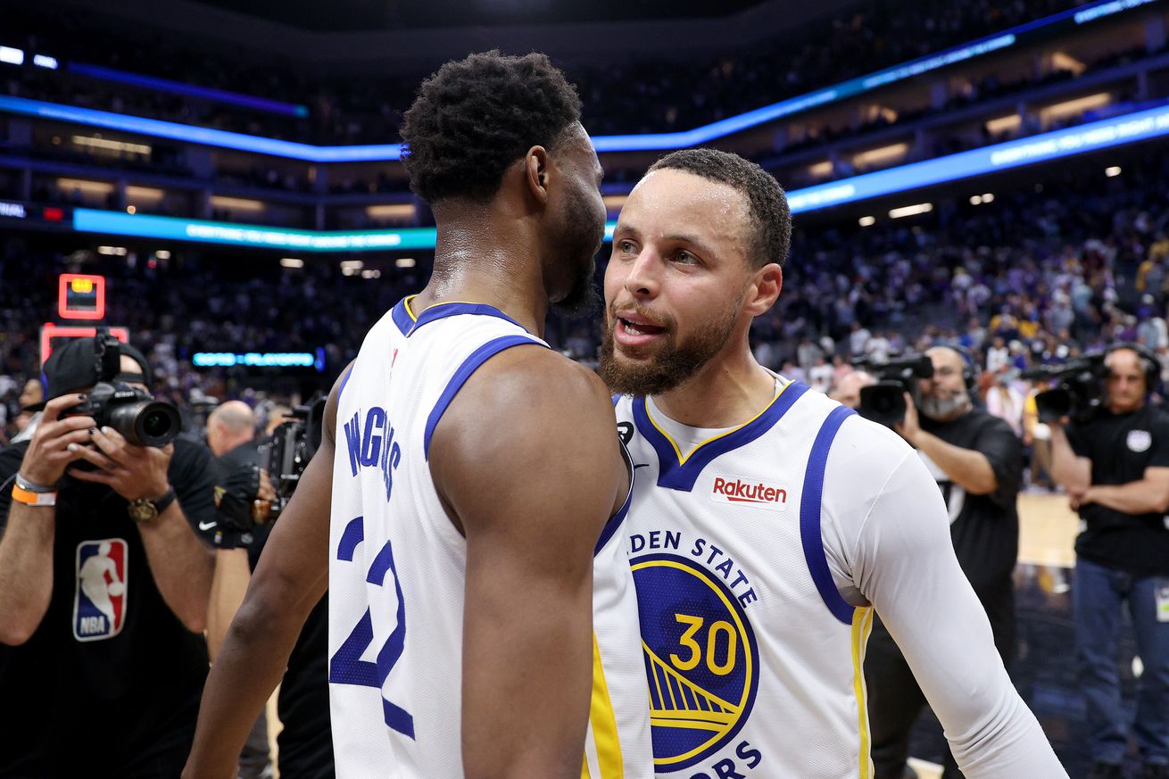 Steph Curry hugging Andrew Wiggins 