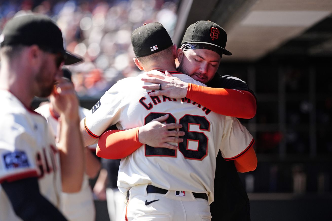 Matt Chapman hugging Patrick Bailey. 