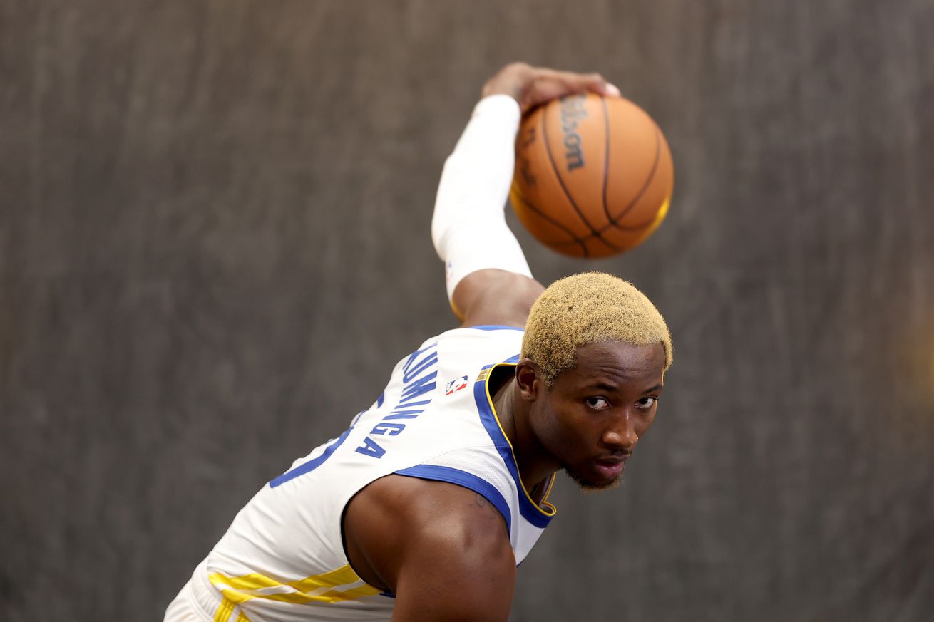 Golden StJonathan Kuminga #00 of the Golden State Warriors poses for the media during the Warriors Media Day at Chase Center on September 30, 2024 in San Francisco, California. ate Warriors Media Day