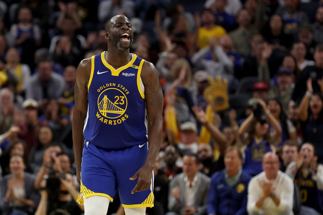 Draymond Green yelling as he goes down the court. 