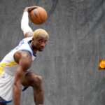 Golden State Warriors forward Jonathan Kuminga (00) dribbles the ball during Media Day