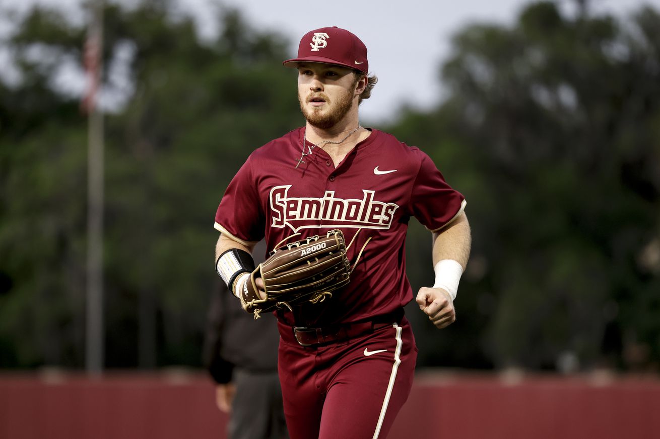 James Tibbs III running off the field in a Florida State jersey. 