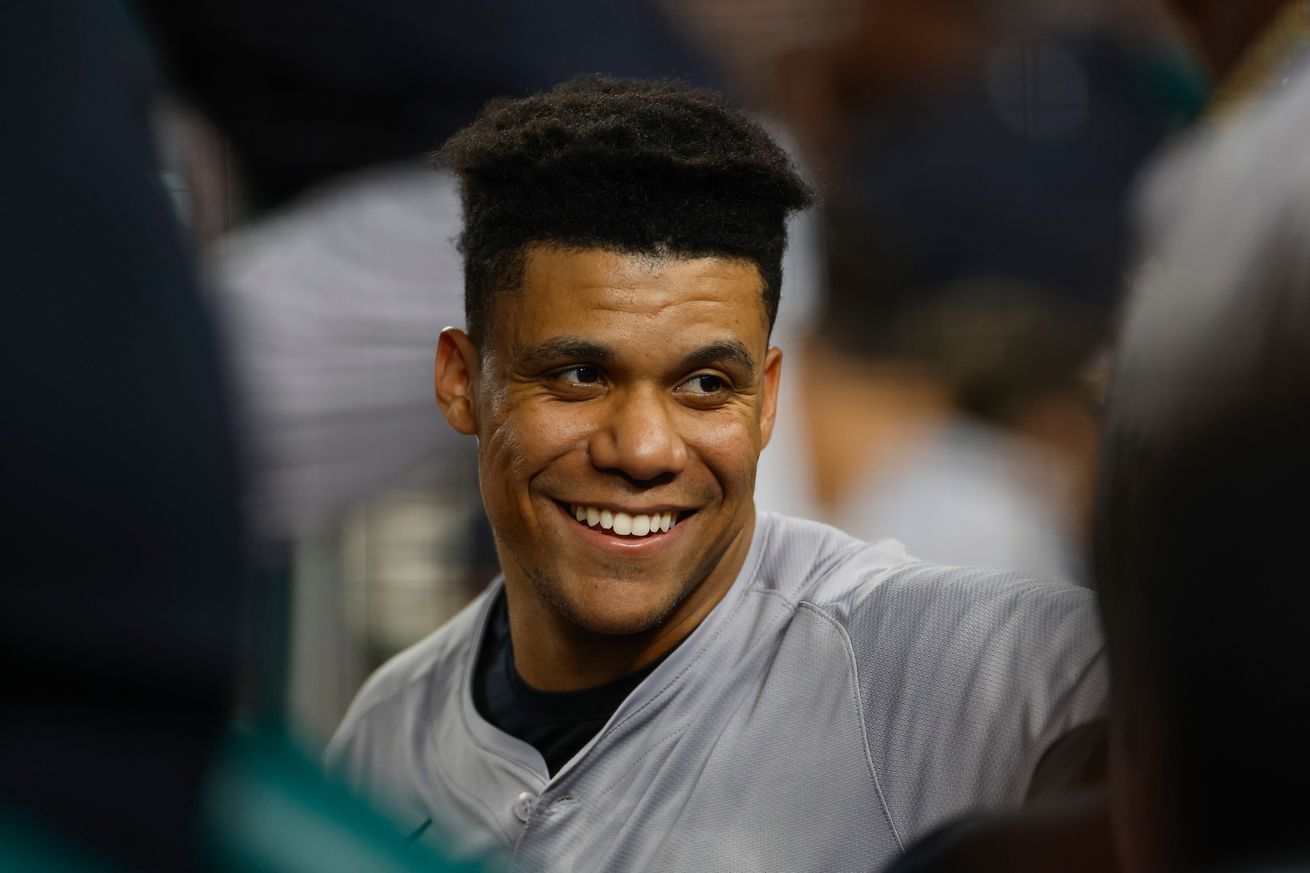 Close up of Juan Soto smiling in the dugout. 