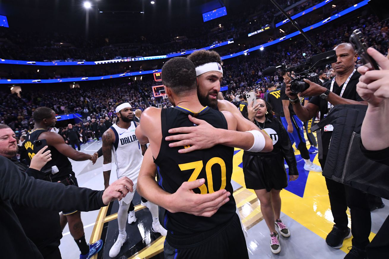 Klay Thompson hugging Steph Curry. 