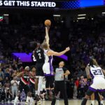 Portland Trail Blazers center Deandre Ayton (2) and Sacramento Kings forward Domantas Sabonis (11) jump for the ball