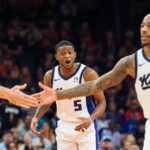 Nov 10, 2024; Phoenix, Arizona, USA; Sacramento Kings guard De'Aaron Fox (5) reacts after guard-forward DeMar DeRozan (10) scores in the second half during a game against the Phoenix Suns at Footprint Center. Mandatory Credit: Allan Henry-Imagn Images