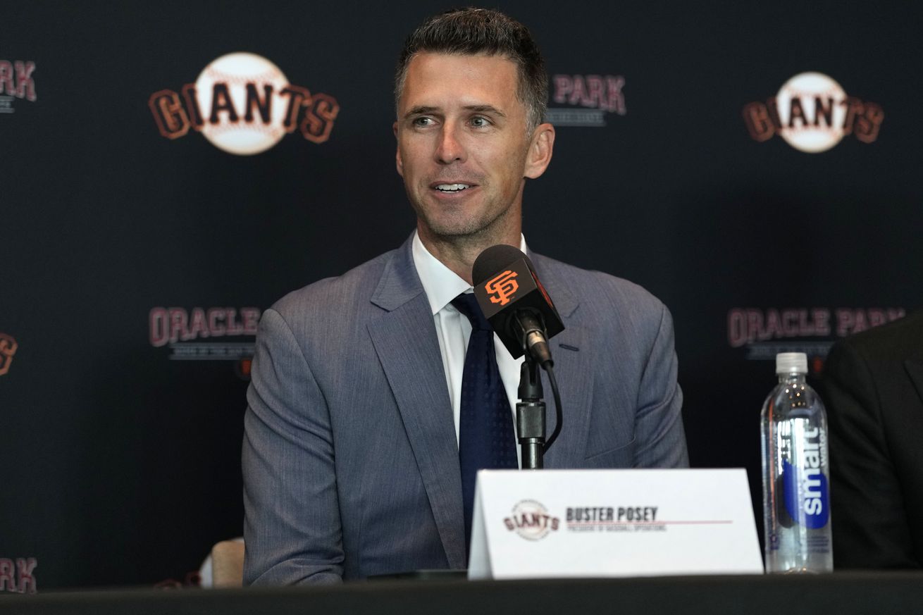 Buster Posey smiling at a press conference. 