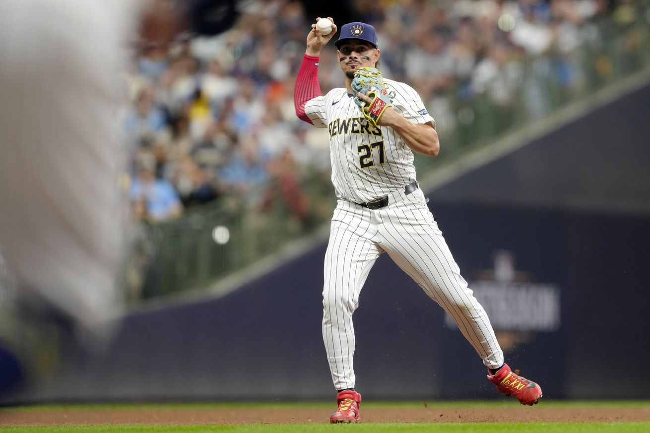 Willy Adames making a throw. 