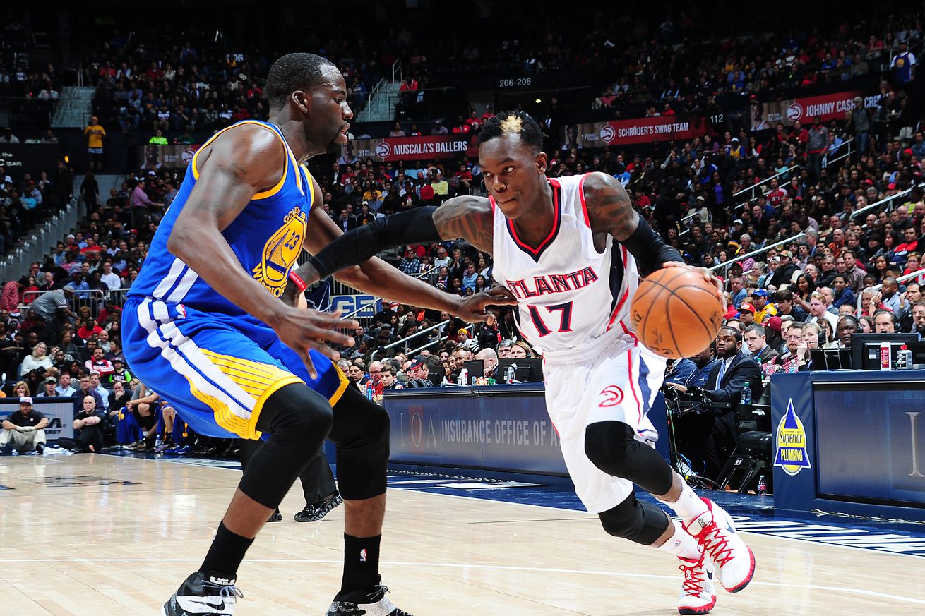 Dennis Schröder, in a Hawks jersey, driving by Draymond Green. 