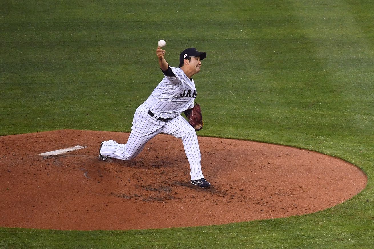 Tomoyuki Sugano throwing a pitch in the WBC. 