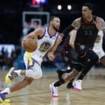 Feb 27, 2024; Washington, District of Columbia, USA; Golden State Warriors guard Stephen Curry (30) drives to the basket as Washington Wizards forward Kyle Kuzma (33) defends in the second half at Capital One Arena. Mandatory Credit: Geoff Burke-USA TODAY Sports