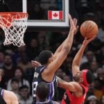 Mar 20, 2024; Toronto, Ontario, CAN; Toronto Raptors forward Bruce Brown (11) drives to the basket as Sacramento Kings forward Keegan Murray (13) tries to defend during the first quarter at Scotiabank Arena.