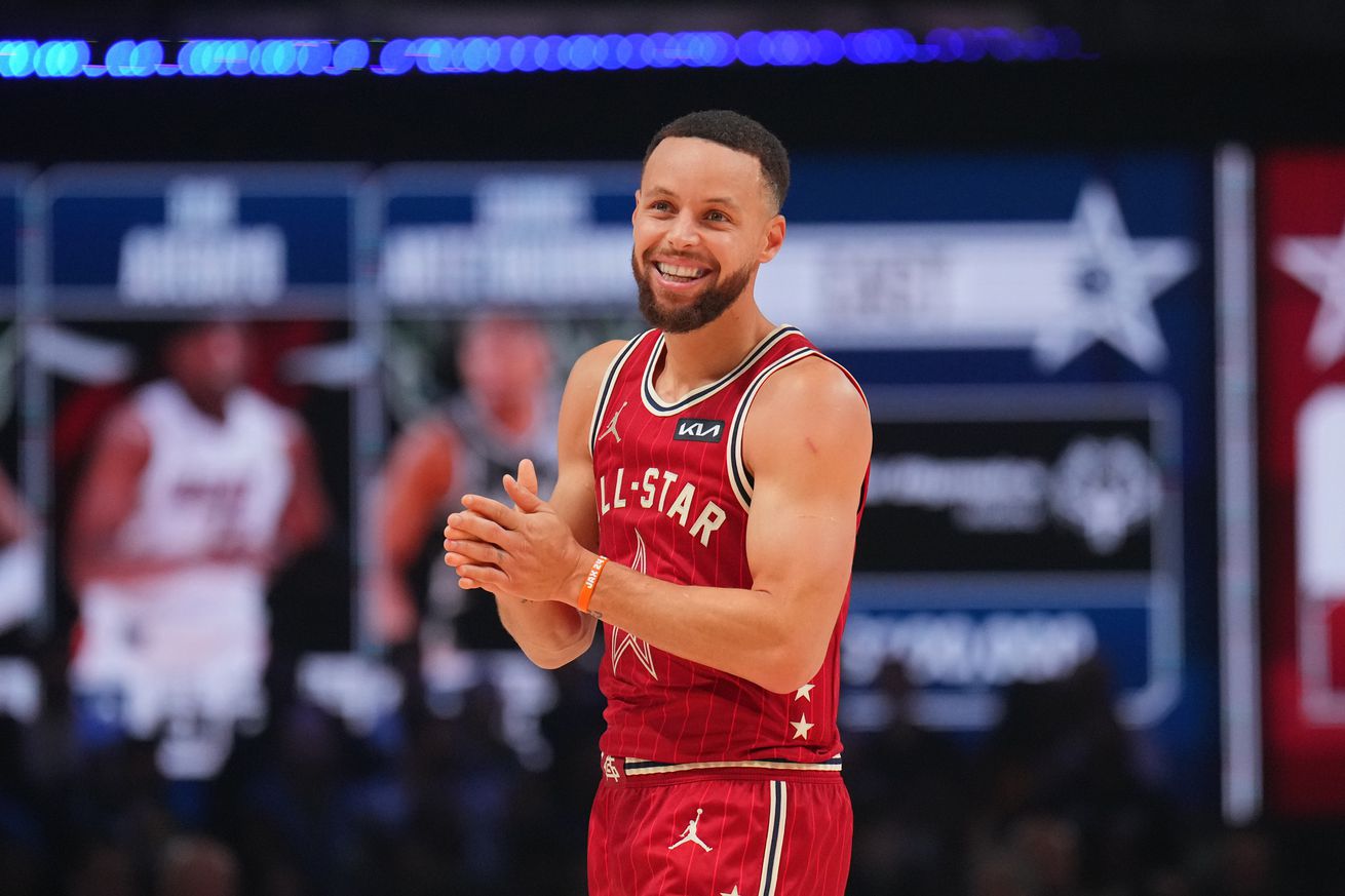 Steph Curry smiling at the All-Star Game. 