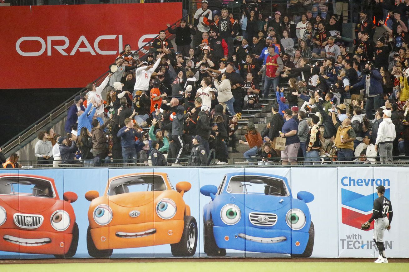 Giants fans behind the left field wall at Oracle Parc