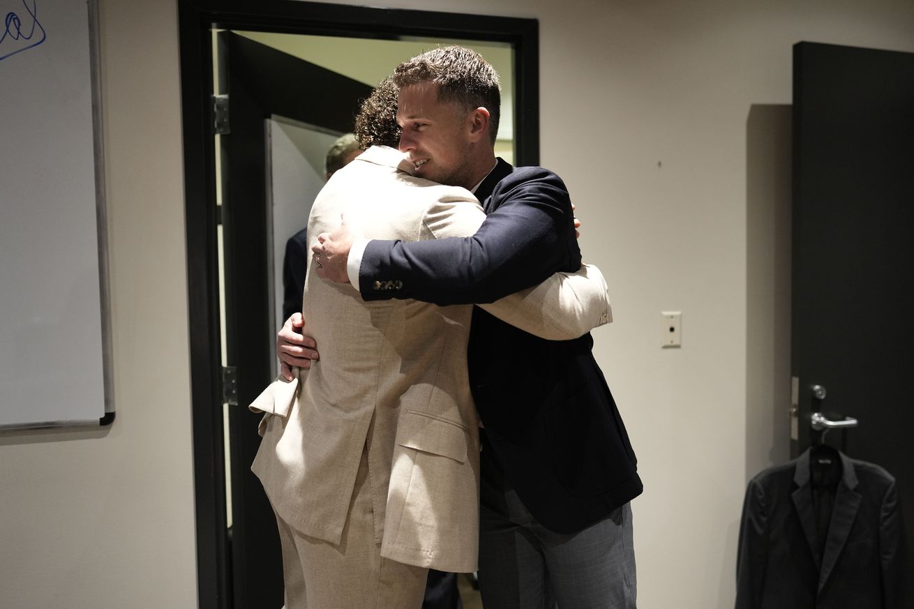 Buster Posey hugging Willy Adames