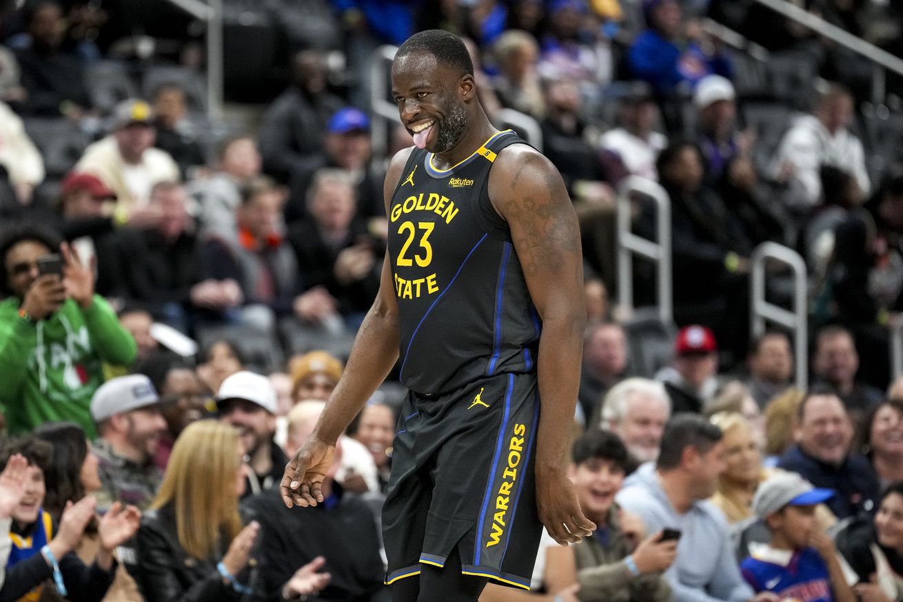 Draymond Green sticking out his tongue while walking off the court. 