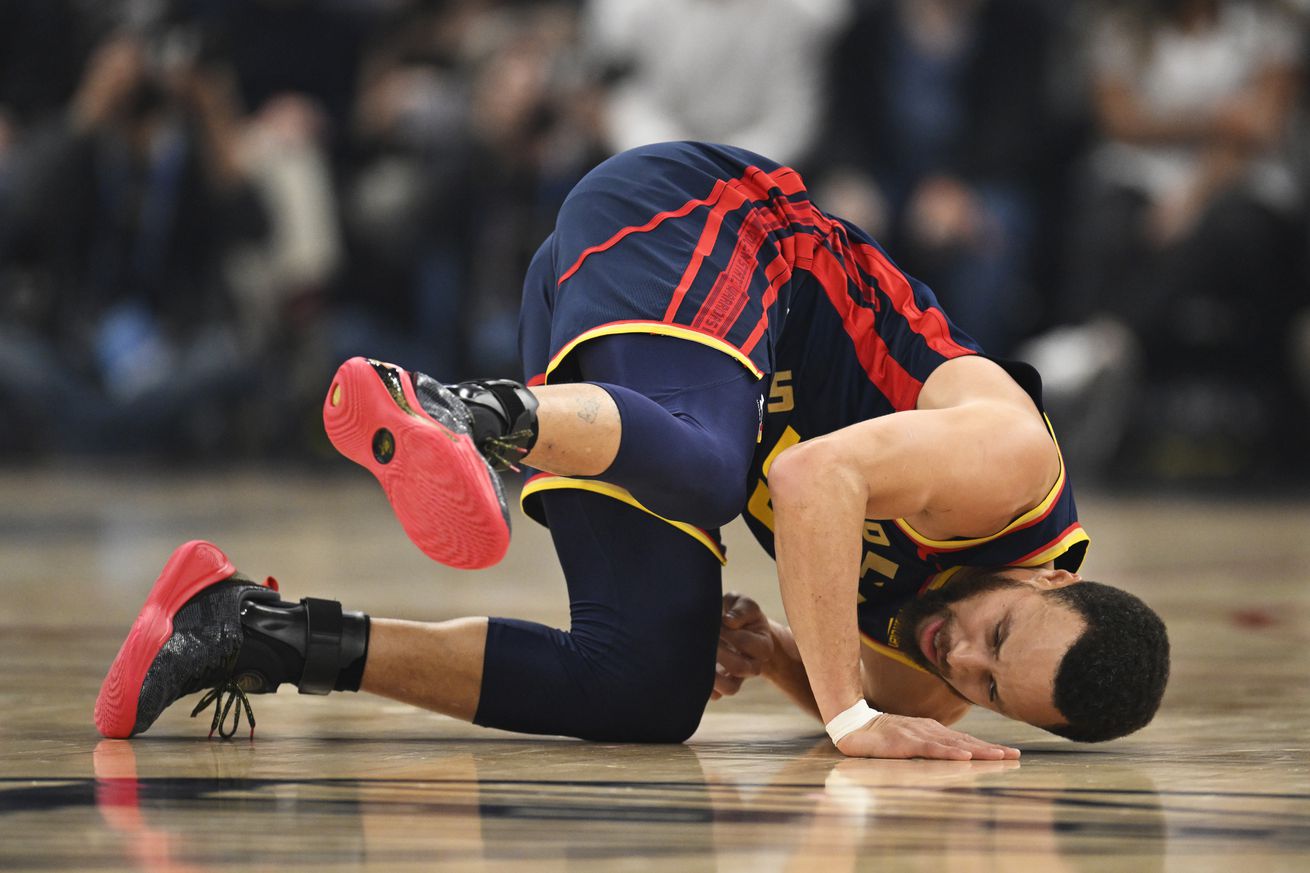 Stephen Curry rolling on the court.