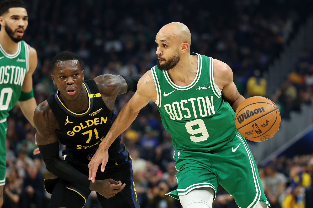 Derrick White driving by Dennis Schröder. 