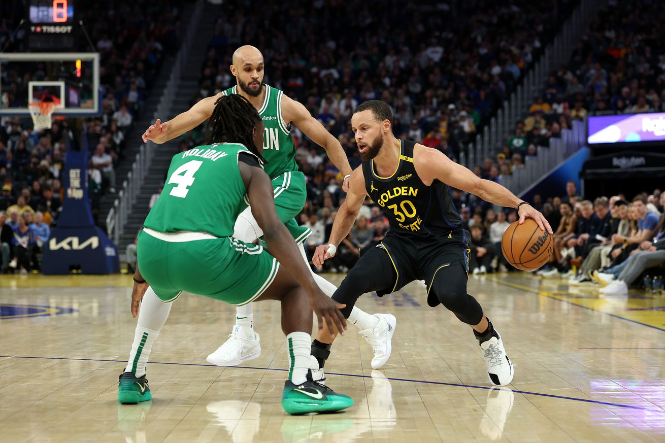 Steph Curry dribbling while defended by Jrue Holiday and Derrick White.