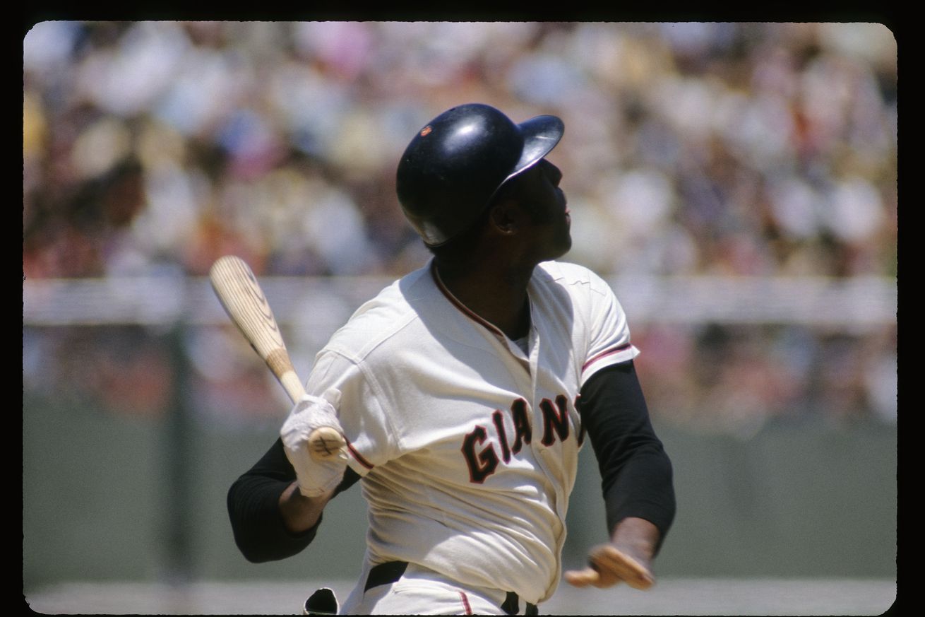 Willie McCovey finishing a swing. 