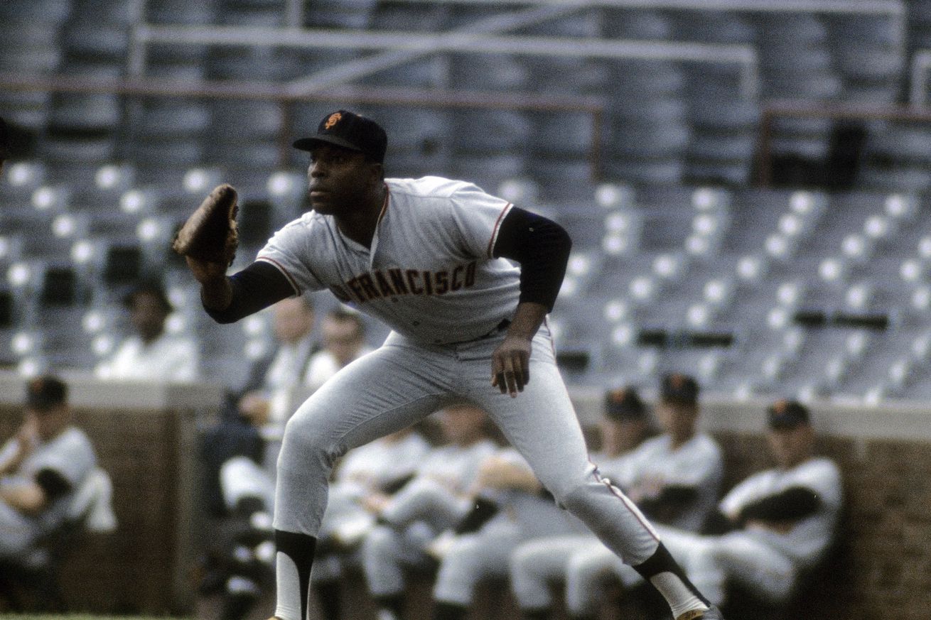 Willie McCovey waiting to catch a ball at first base. 