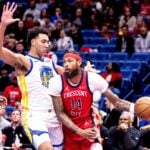 Nov 22, 2024; New Orleans, Louisiana, USA; New Orleans Pelicans forward Brandon Ingram (14) dribbles against Golden State Warriors forward Trayce Jackson-Davis (32) during first half at Smoothie King Center. Mandatory Credit: Stephen Lew-Imagn Images