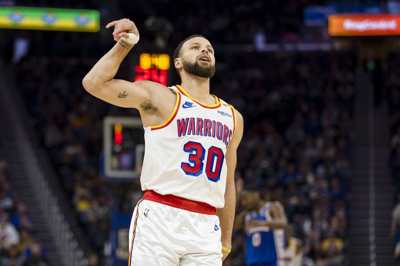 Steph Curry celebrating after a made three.