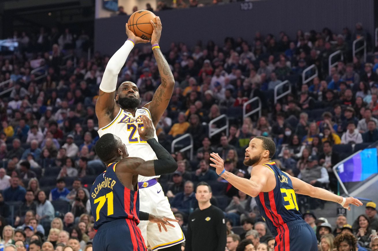 LeBron James shooting a jumper over Dennis Schröder, with Steph Curry nearby. 