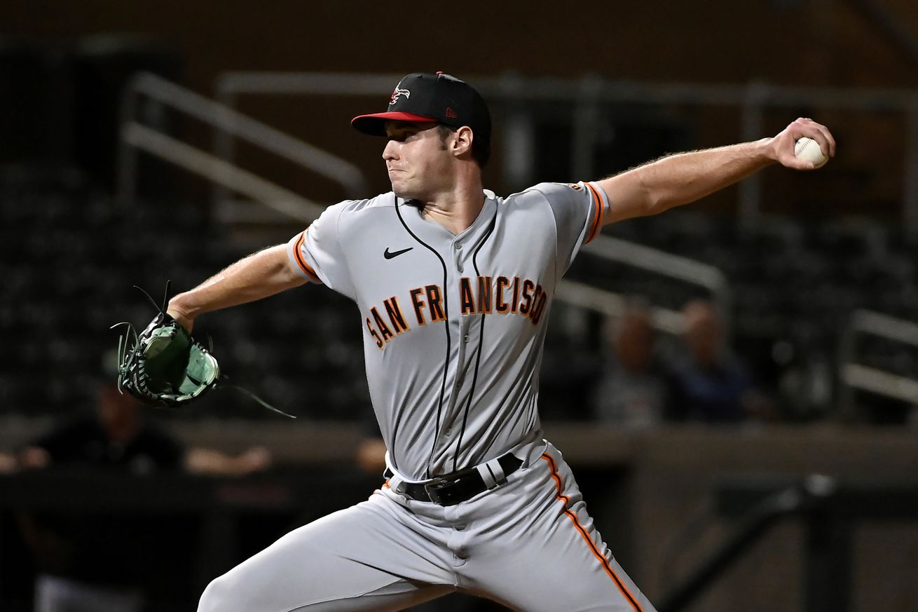 View from the side of Jack Choate throwing a pitch in the AFL. 