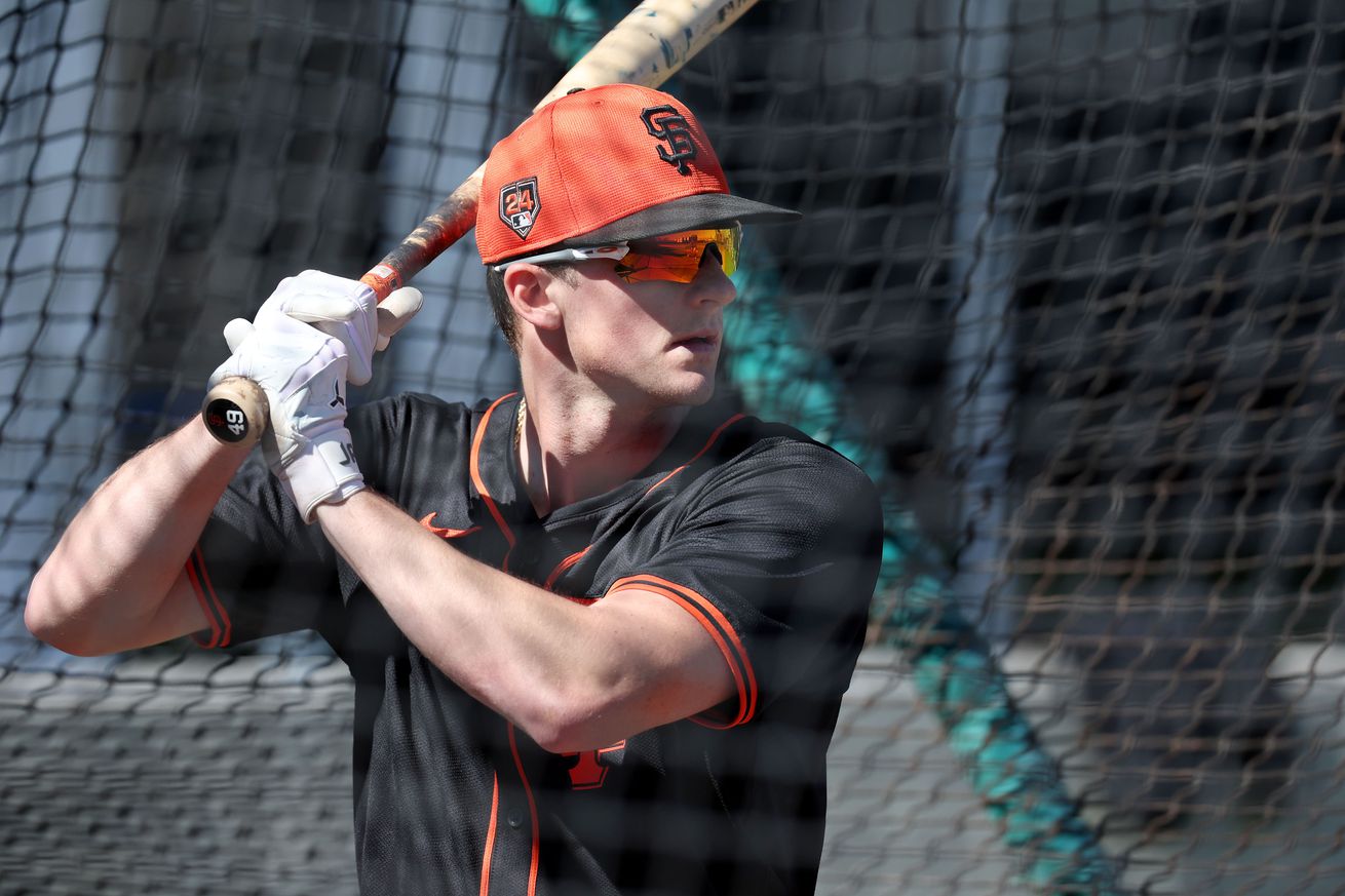 Tyler Fitzgerald in a batting cage at Spring Training.